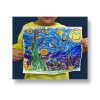 Young boy holding proudly holding up van gogh starry night painting after private art class.